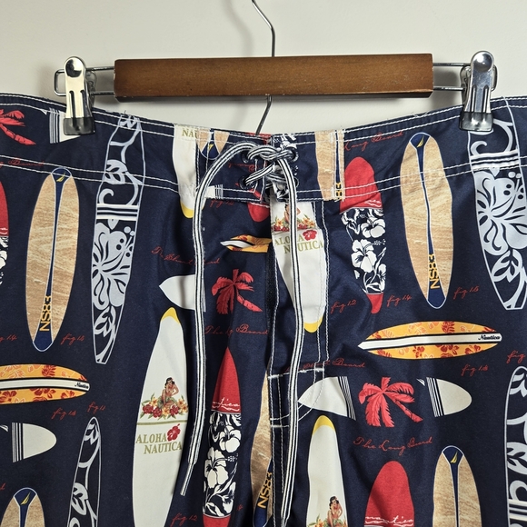 Nautica Blue and Red Swim Trunks with Surfboard Design - Picture 3 of 6